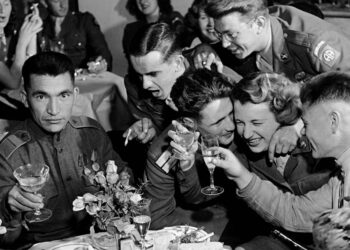 Russian and American soldiers, part of the Allied occupation forces, at a multi-national party, Berlin, Germany, 1945 © Robert Capa © International Center of Photography/Magnum Photos