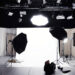 A photographic studio with a backdrop, lights, and softboxes. Original public domain image from Wikimedia Commons