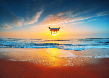 Beautiful morning over the sea and flying drone.