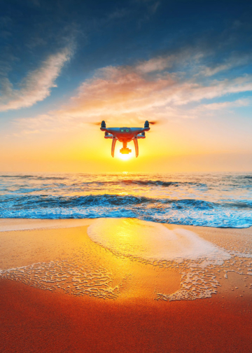 Beautiful morning over the sea and flying drone.
